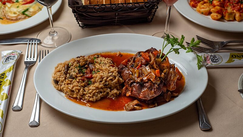 Steak entree with side of rice with red wine